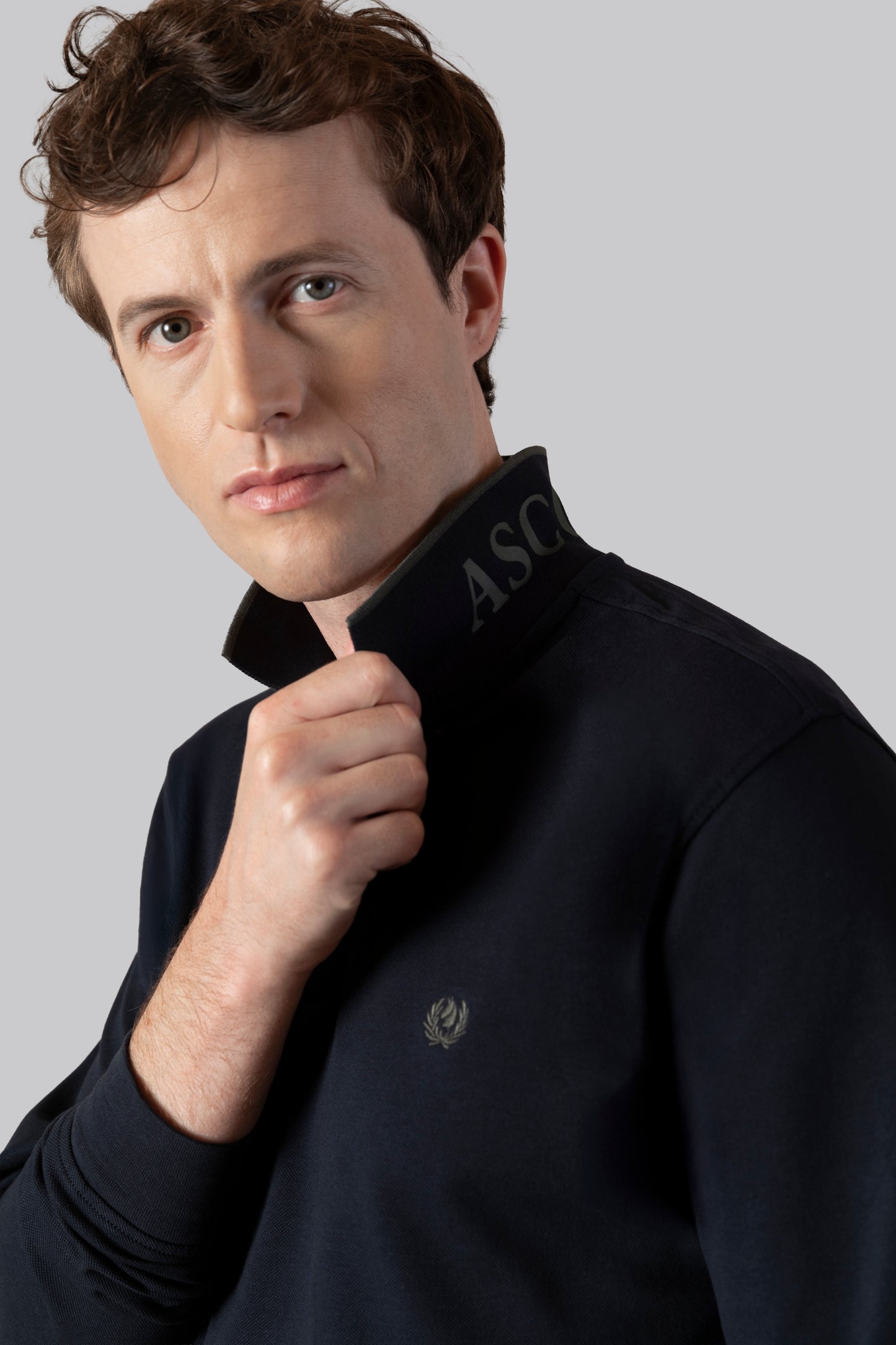 Piqué polo with contrasting stripe color on the collar and logo print under the collar