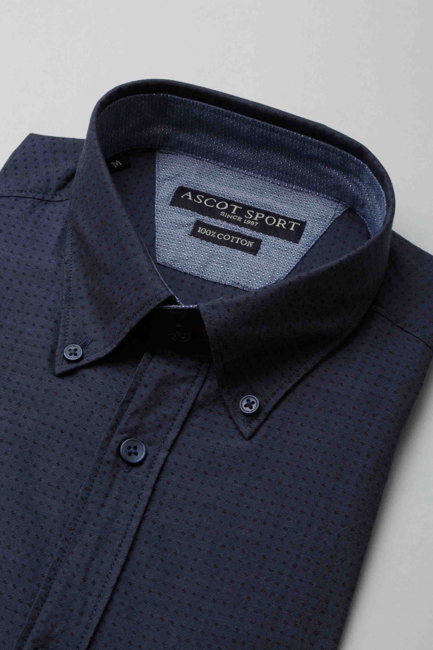 Camicia blu con jacquard effetto pois