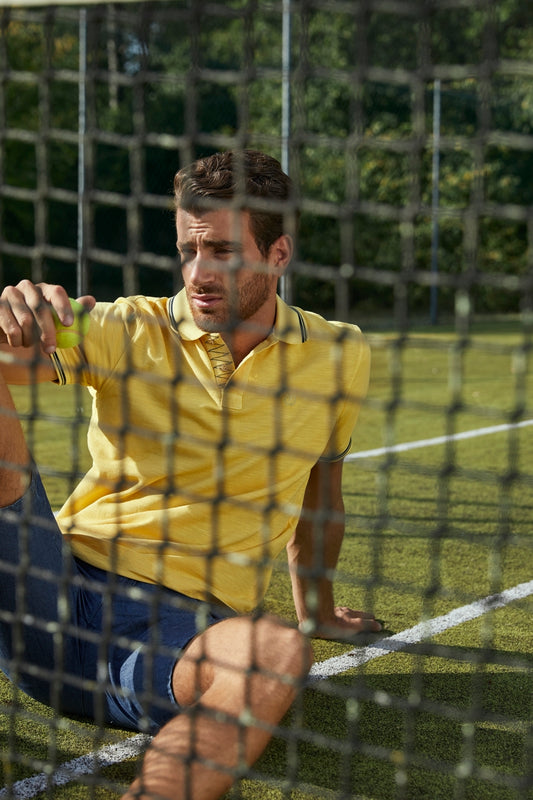 Yellow polo shirt in flamed piqué fabric