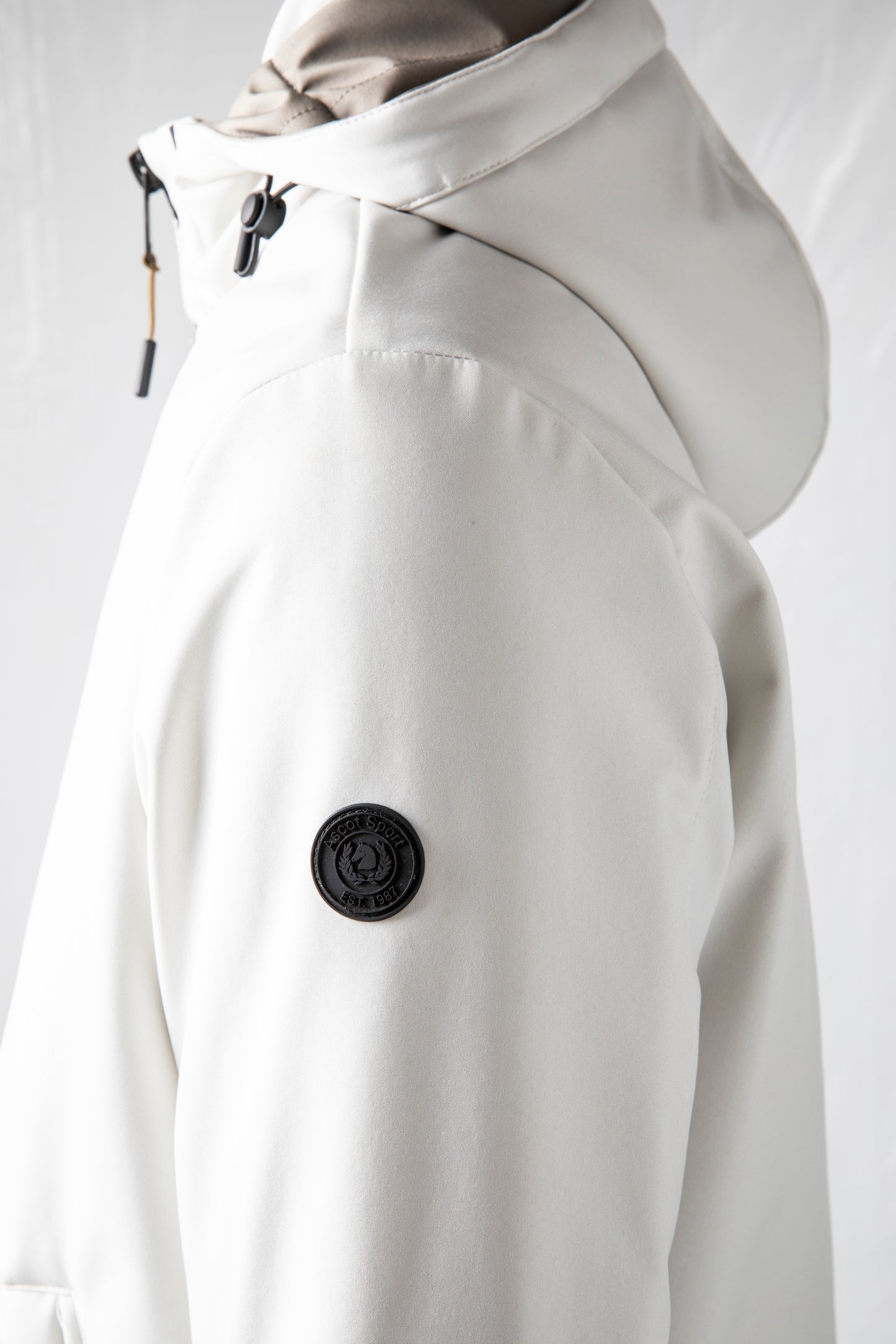 Padded jacket in technical fabric with detachable hood