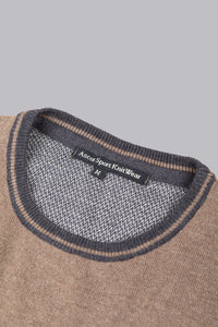 Maglione beige con dettagli a contrasto